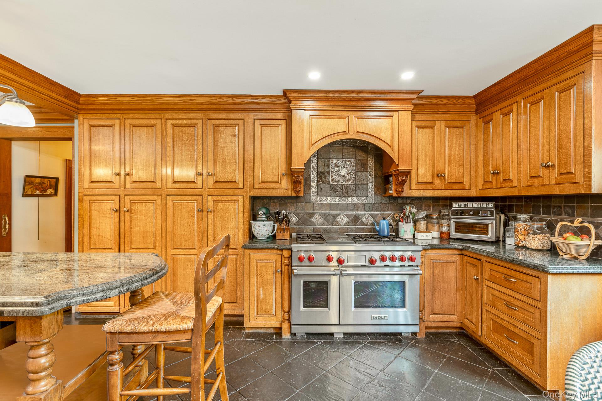 4 Horse Hollow Road Locust Valley, NY 11560 - Photo 17 of 48 a kitchen with stainless steel appliances granite countertop a stove and a sink