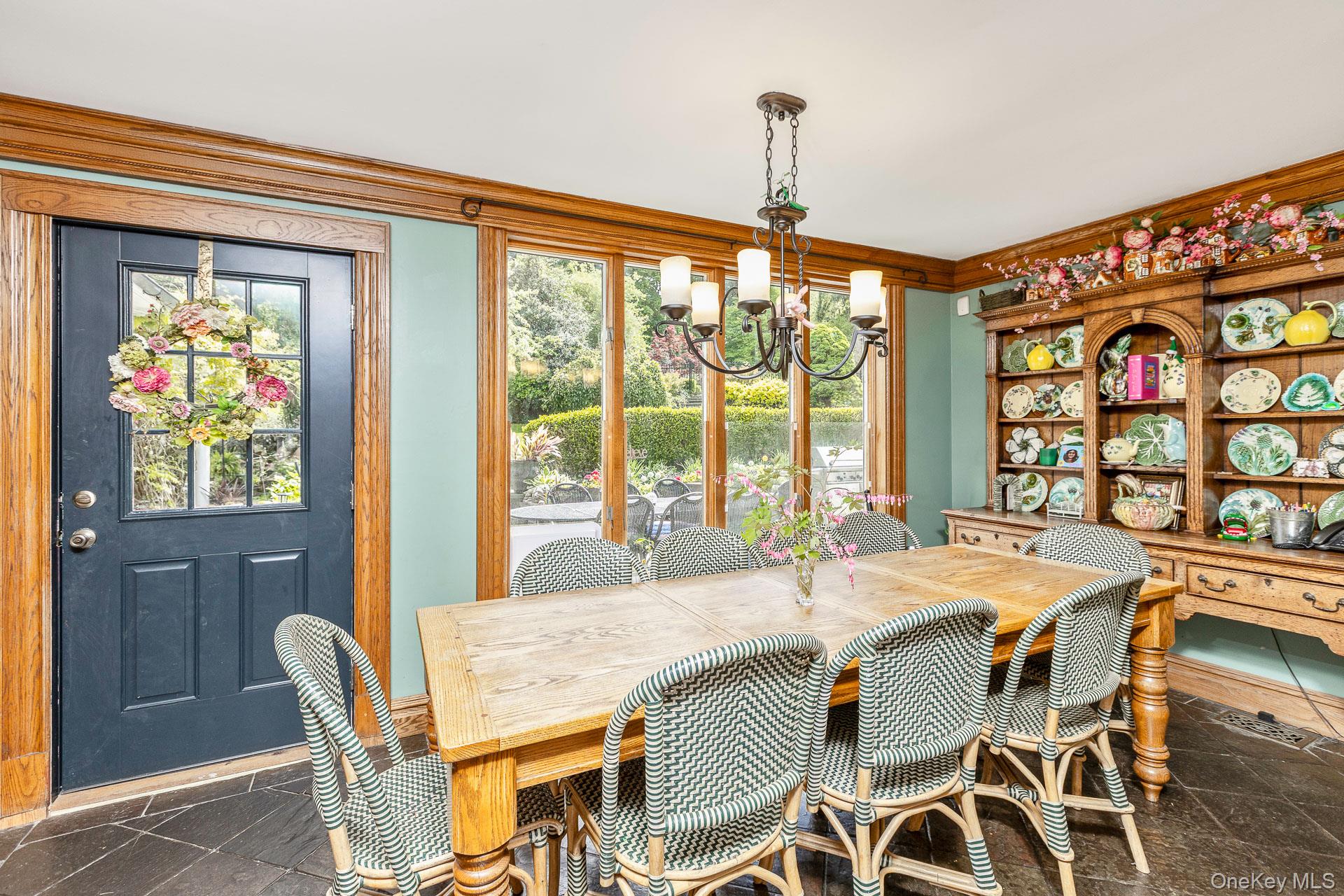 4 Horse Hollow Road Locust Valley, NY 11560 - Photo 18 of 48 a dining room with furniture a chandelier and wooden floor