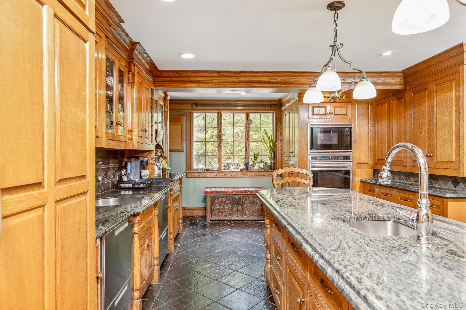 4 Horse Hollow Road Locust Valley, NY 11560 - Photo 20 of 48 a kitchen with stainless steel appliances granite countertop sink stove and granite counter top