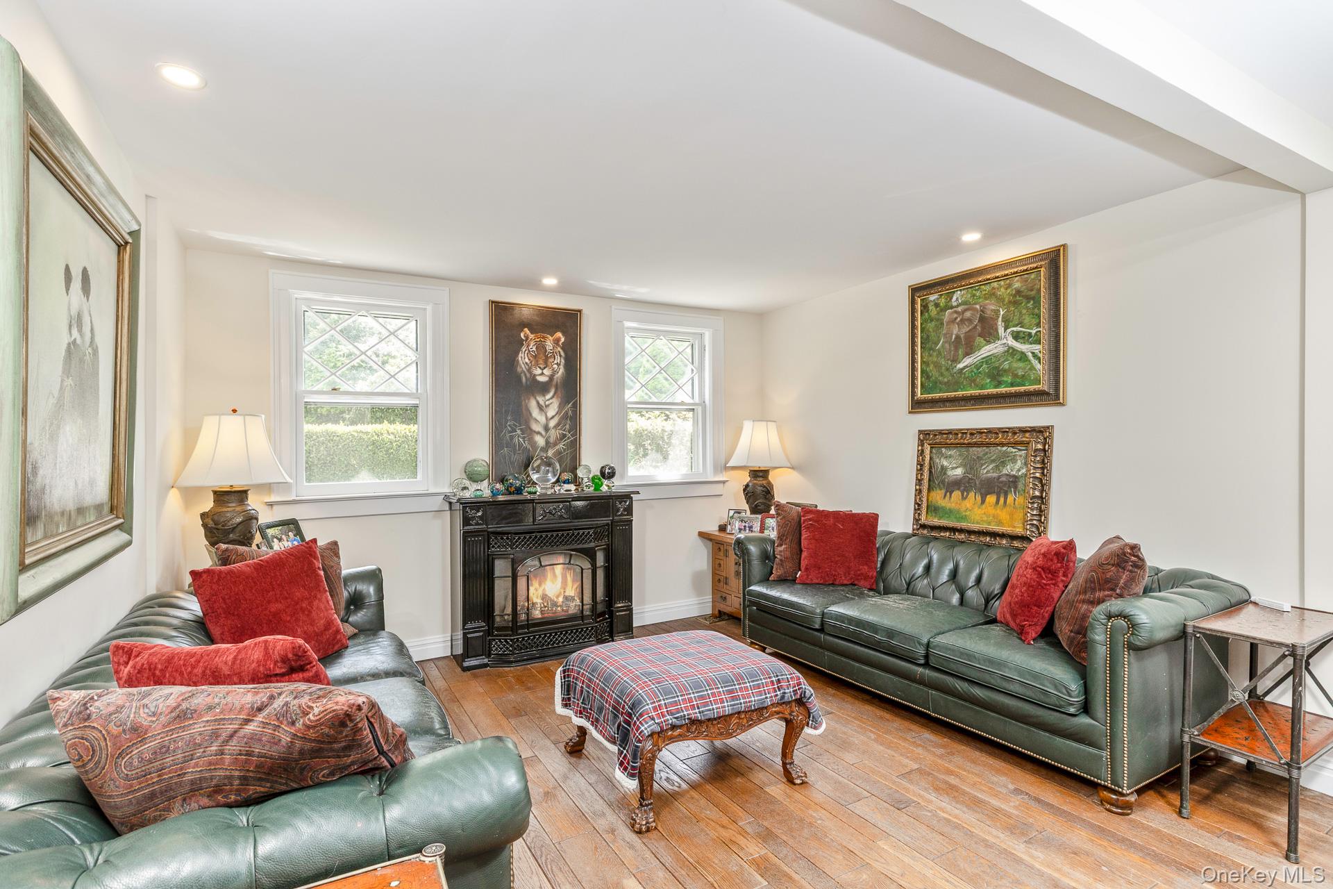 4 Horse Hollow Road Locust Valley, NY 11560 - Photo 21 of 48 a living room with furniture and a fireplace