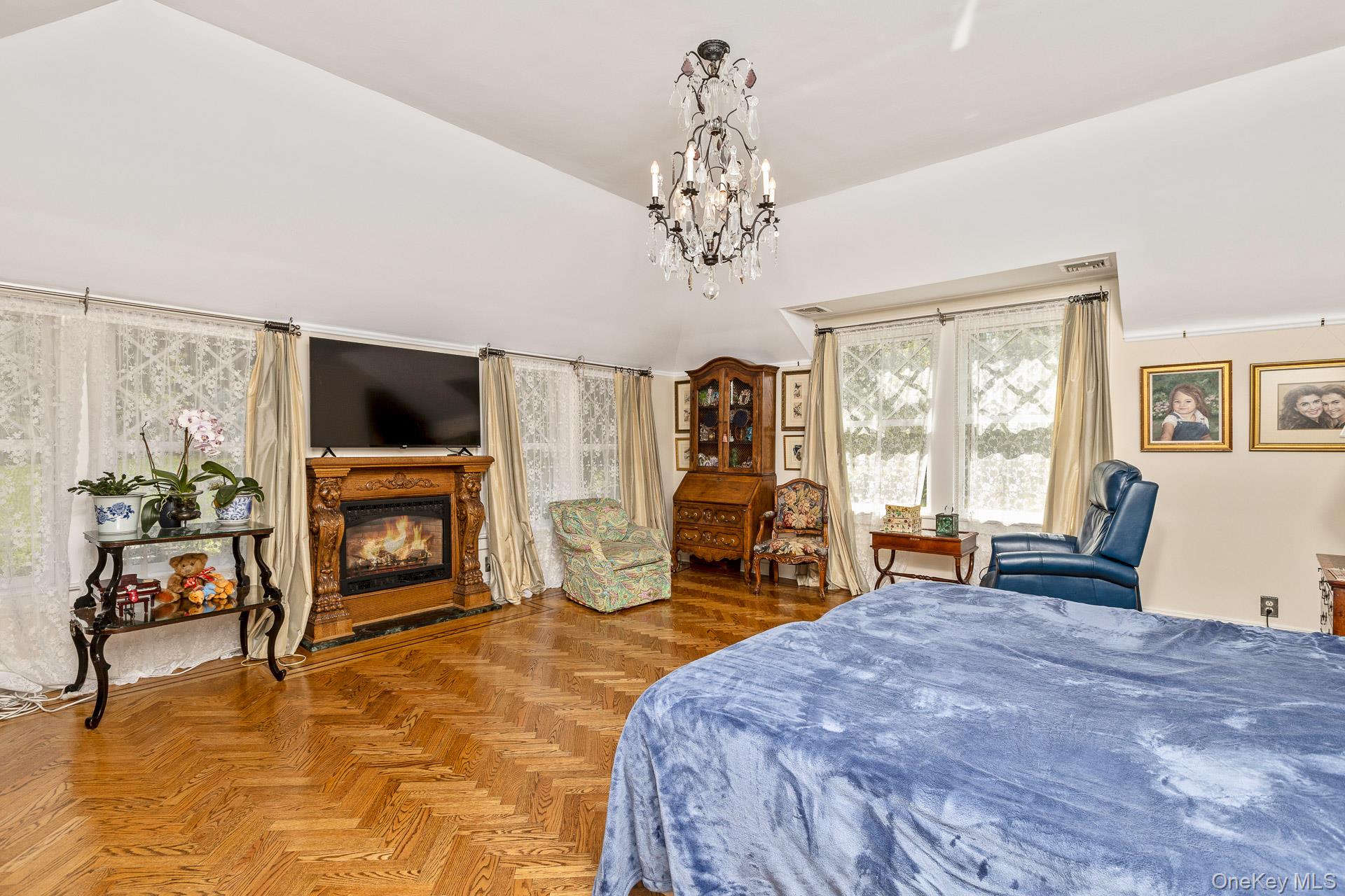 4 Horse Hollow Road Locust Valley, NY 11560 - Photo 23 of 48 a spacious bedroom with a bed and a flat screen tv