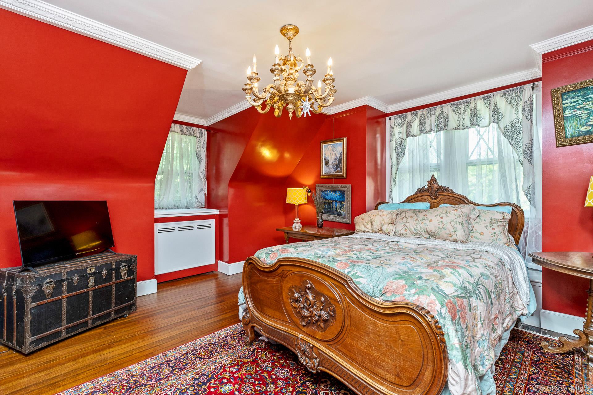 4 Horse Hollow Road Locust Valley, NY 11560 - Photo 26 of 48 a bedroom with a bed and flat screen tv