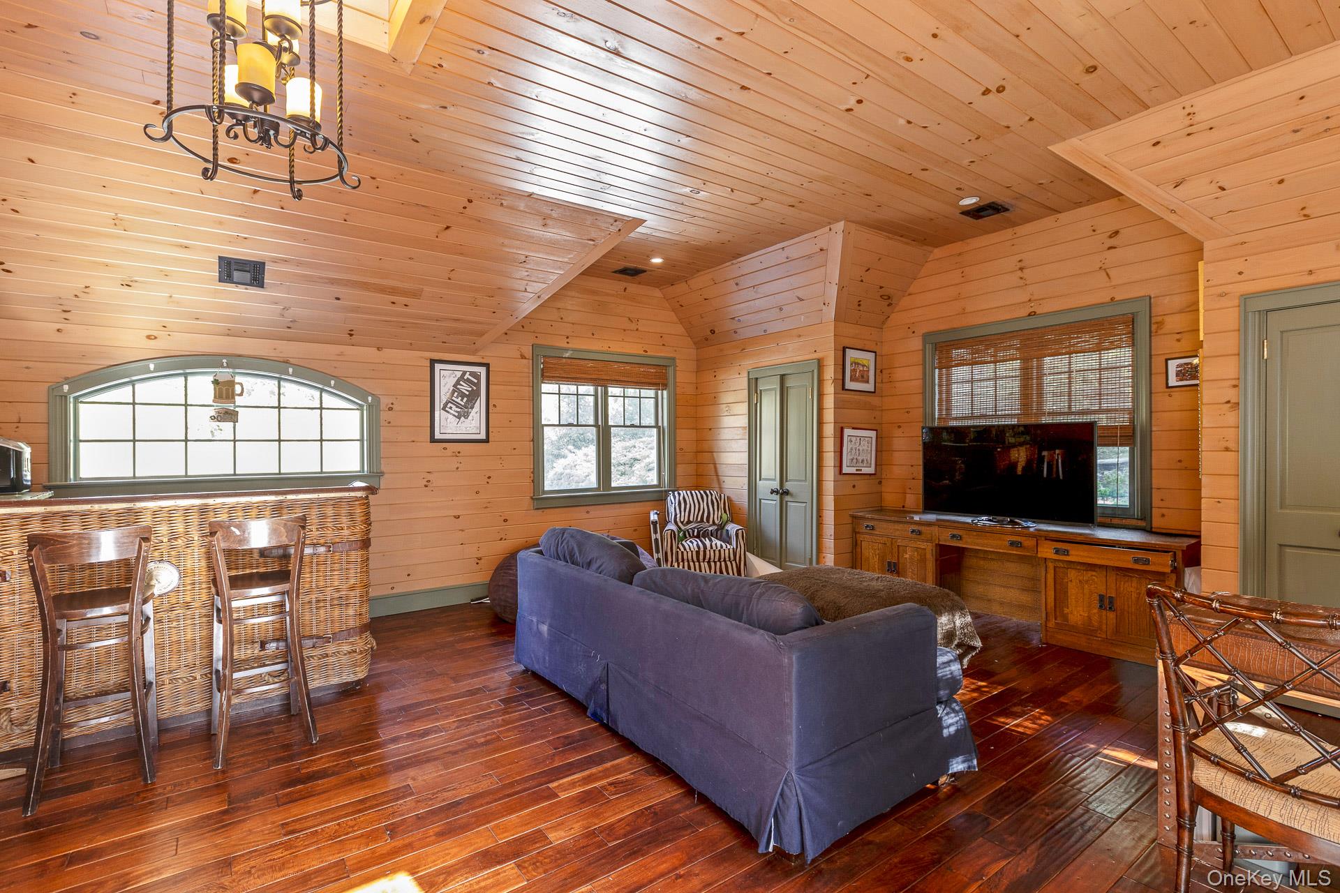 4 Horse Hollow Road Locust Valley, NY 11560 - Photo 34 of 48 a living room with furniture and a flat screen tv