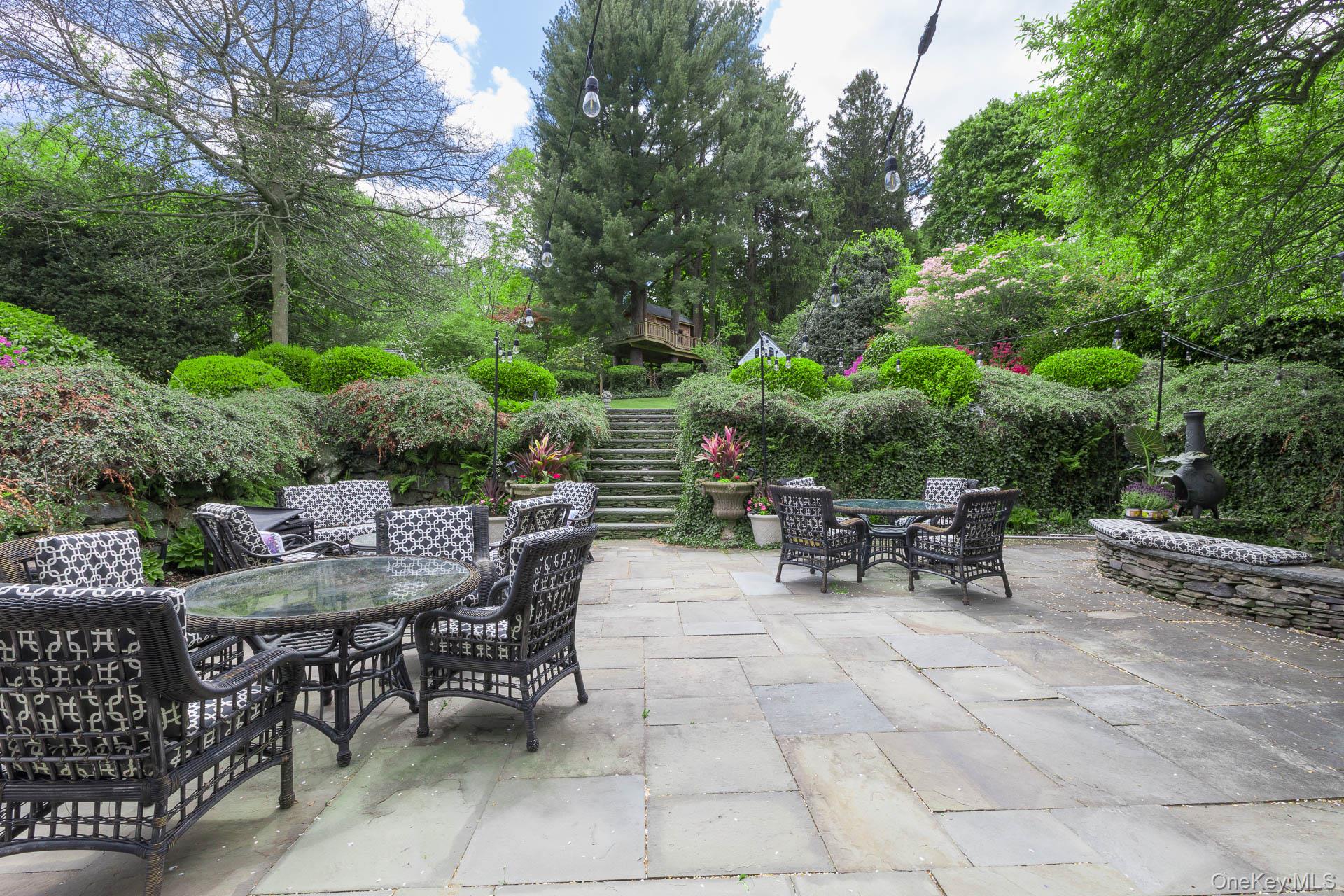 4 Horse Hollow Road Locust Valley, NY 11560 - Photo 36 of 48 a view of outdoor dining space with a table and chairs