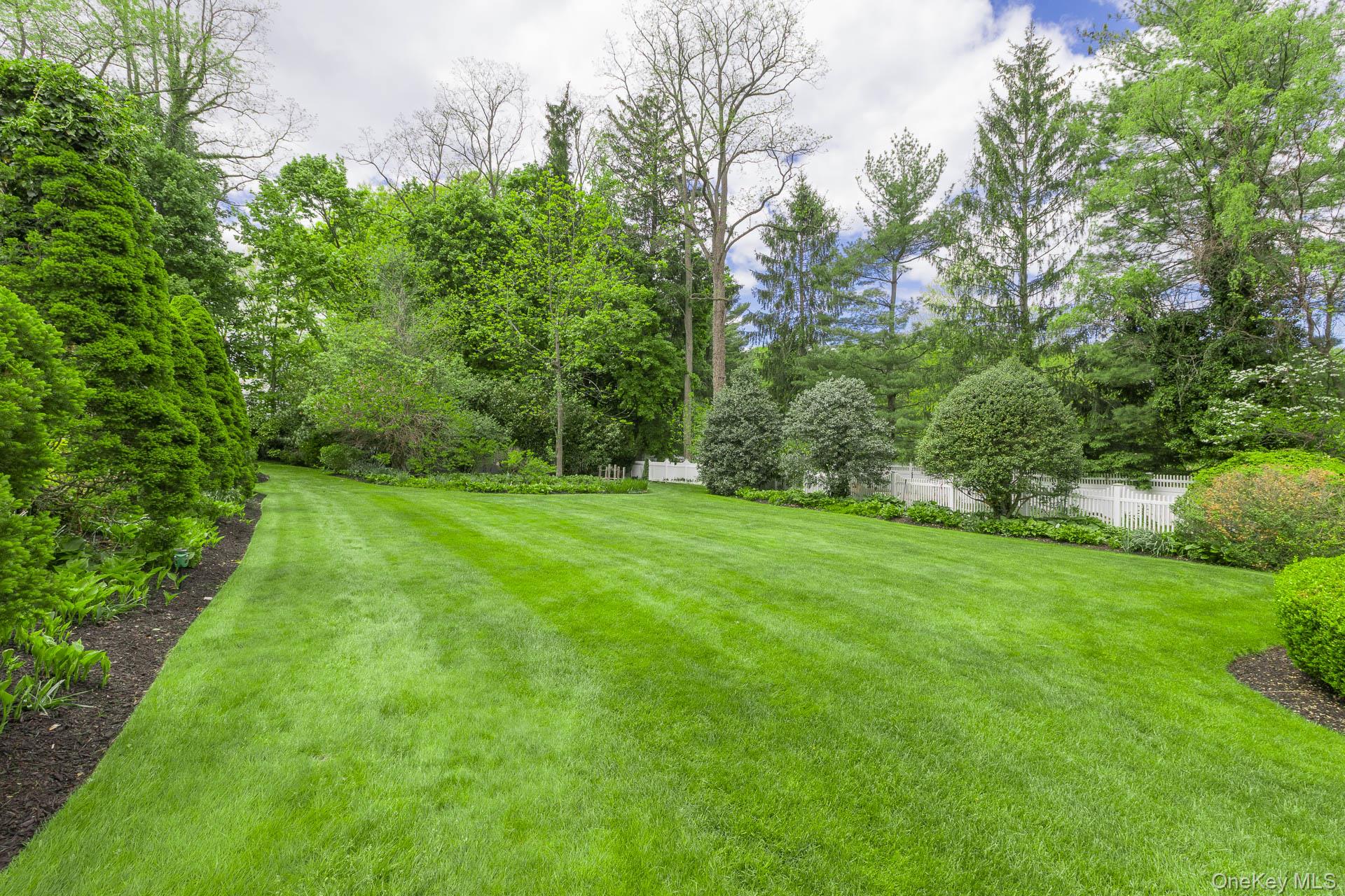 4 Horse Hollow Road Locust Valley, NY 11560 - Photo 39 of 48 a view of a grassy field with trees