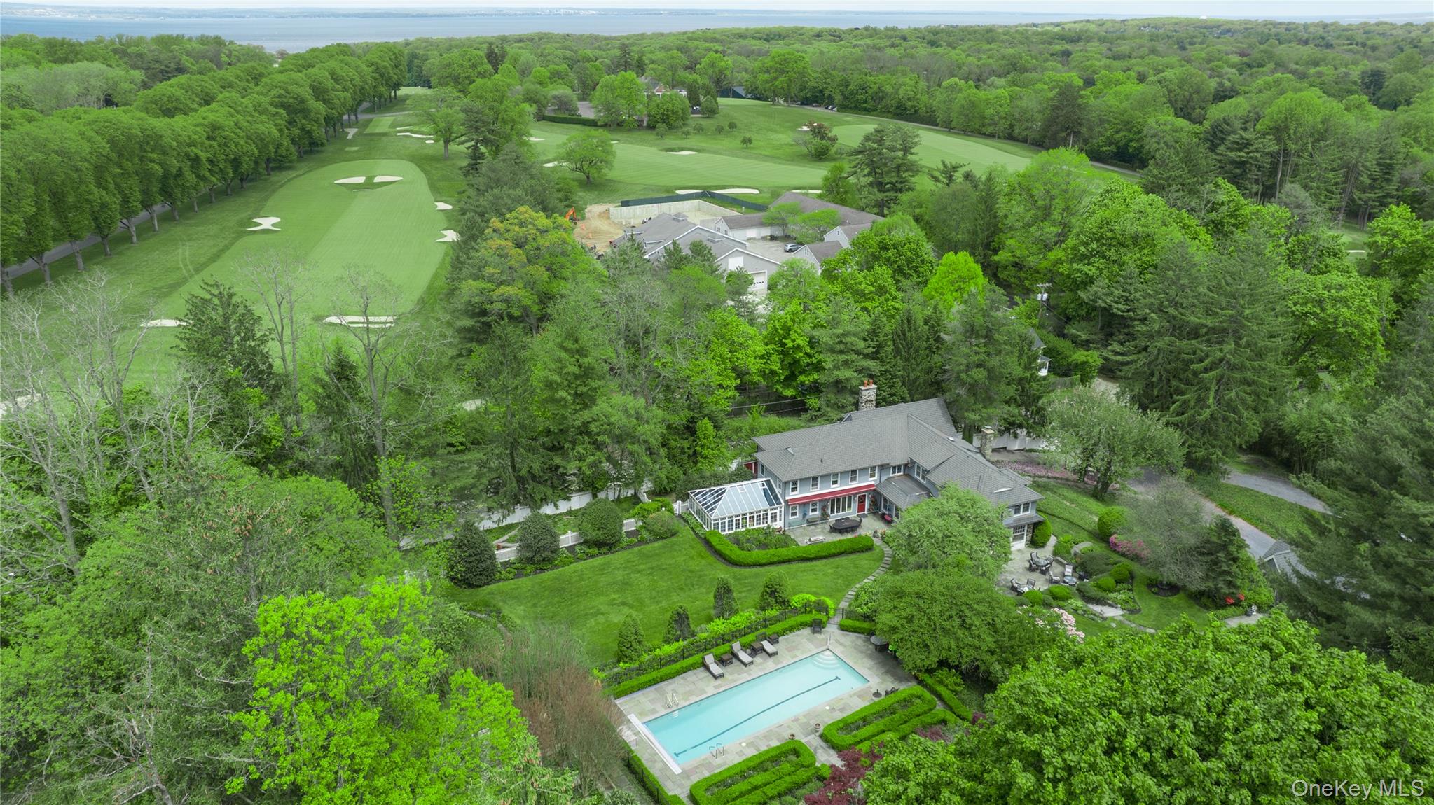4 Horse Hollow Road Locust Valley, NY 11560 - Photo 47 of 48 a aerial view of a house with pool yard and outdoor seating