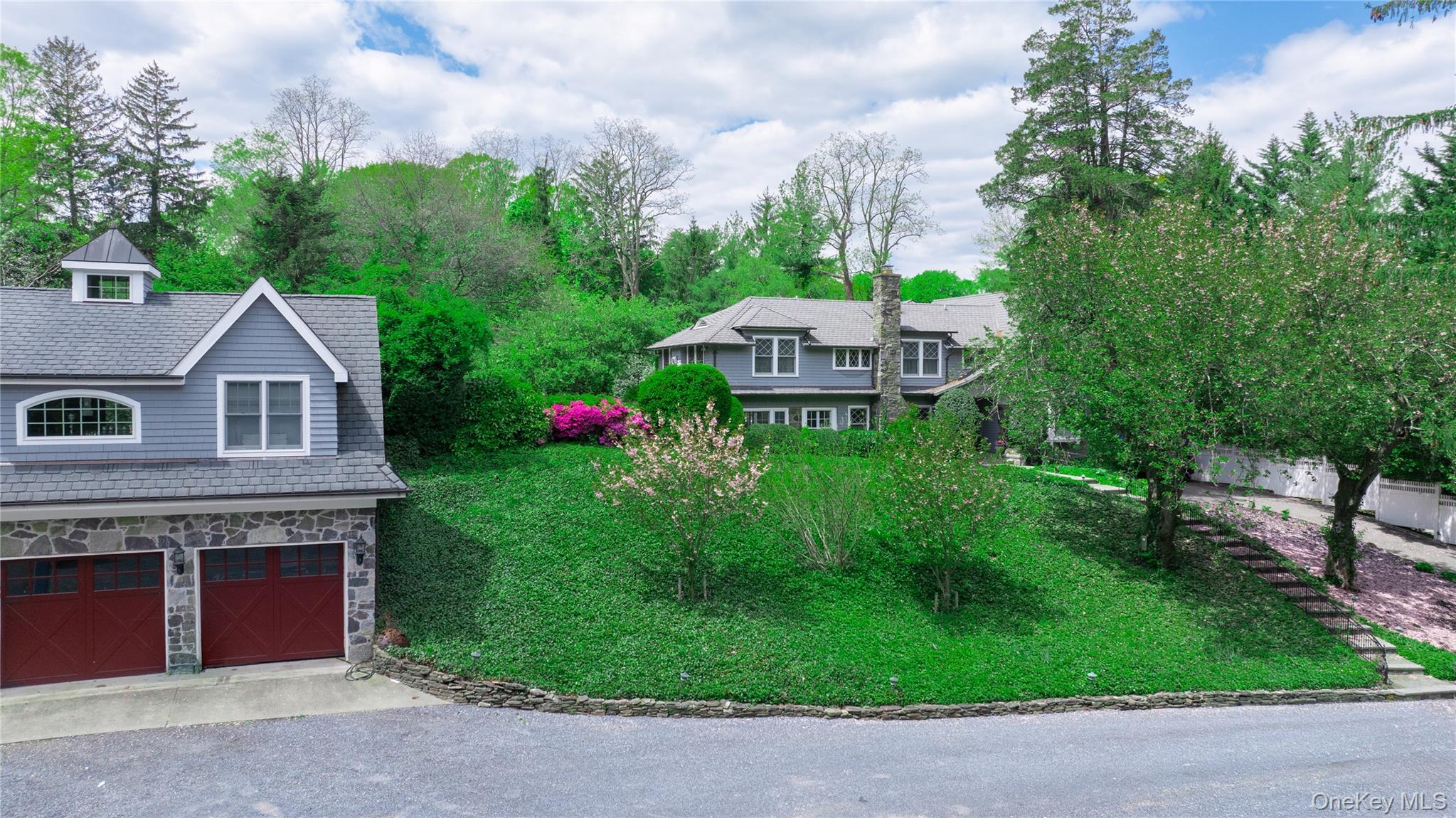 4 Horse Hollow Road Locust Valley, NY 11560 - Photo 48 of 48 a aerial view of a house with table and chairs and a yard