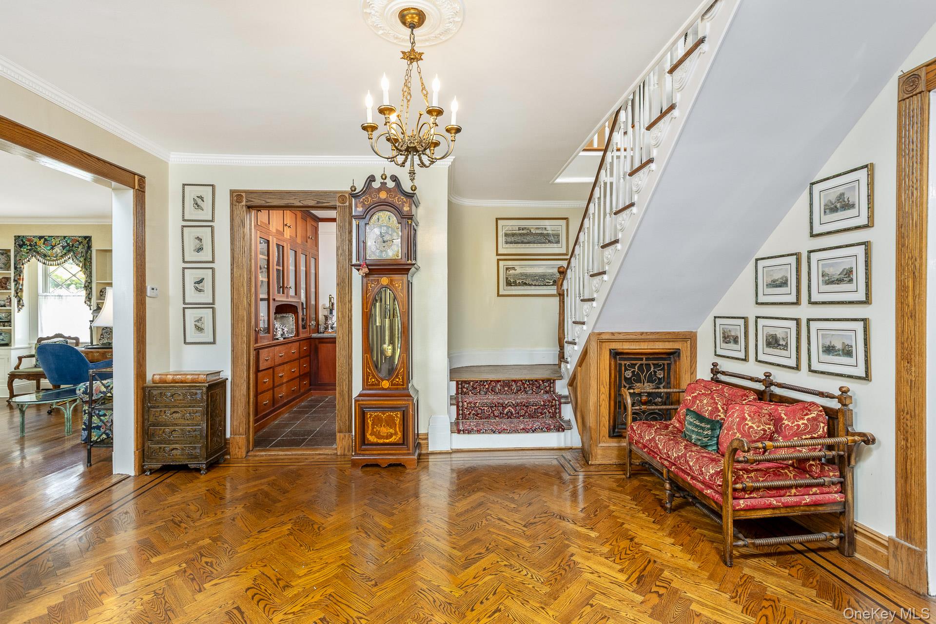 4 Horse Hollow Road Locust Valley, NY 11560 - Photo 8 of 48 a bedroom with furniture and a chandelier