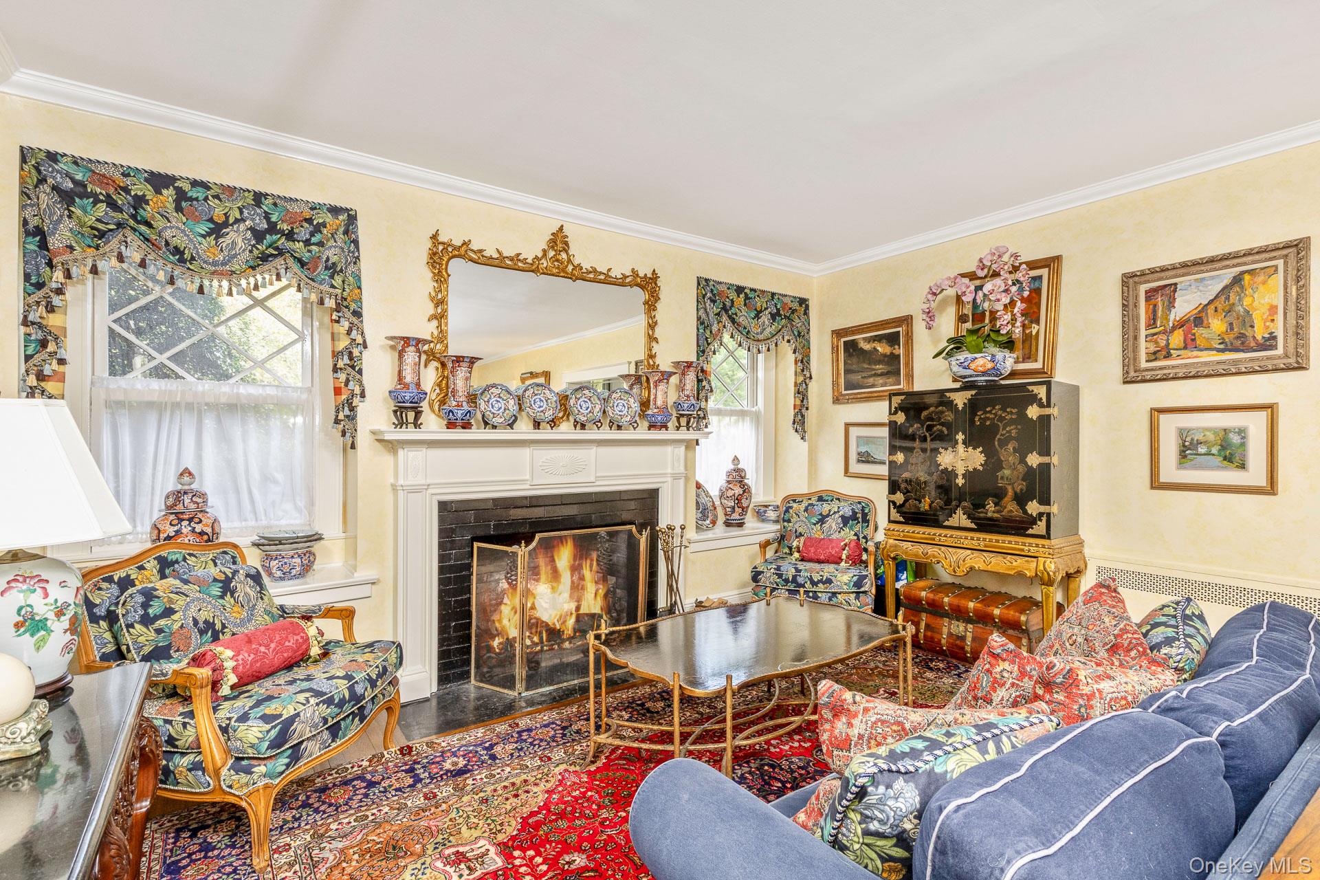 4 Horse Hollow Road Locust Valley, NY 11560 - Photo 9 of 48 a living room with furniture and a fireplace