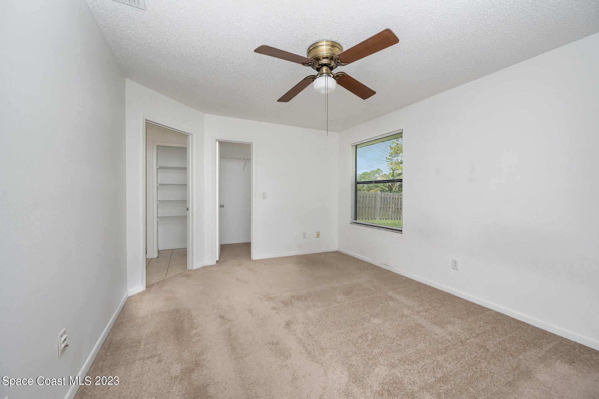 1061 Spring Street Northwest Palm Bay, FL 32907 - Photo 13 of 23 a view of an empty room with a window