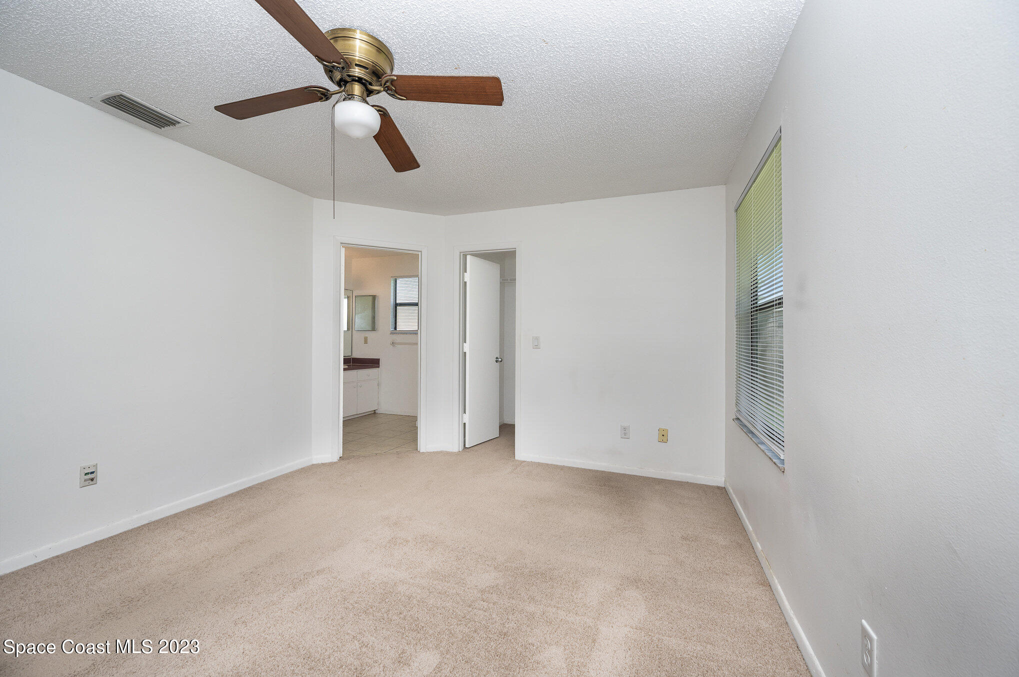 1061 Spring Street Northwest Palm Bay, FL 32907 - Photo 14 of 23 wooden floor in an empty room