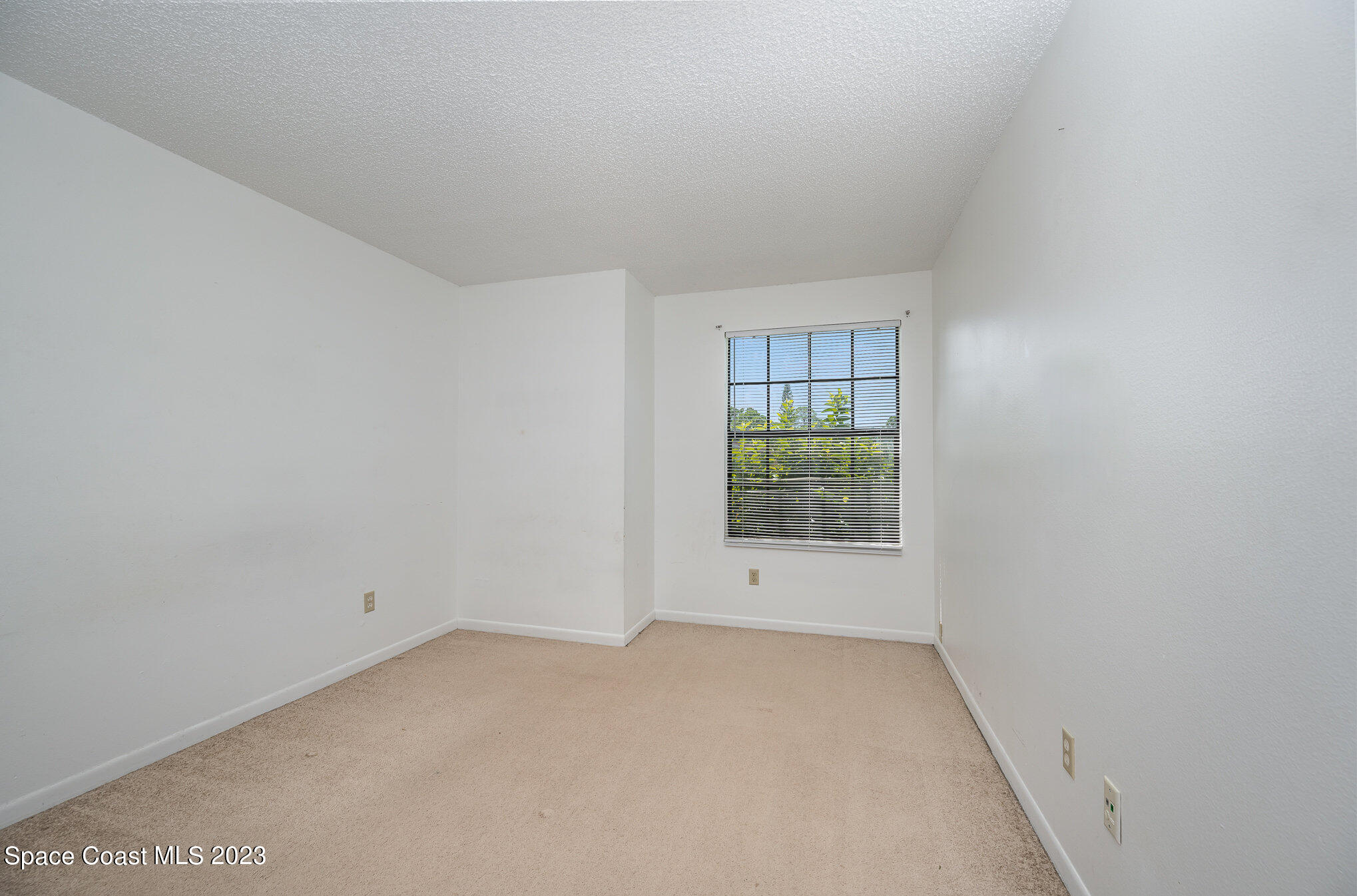 1061 Spring Street Northwest Palm Bay, FL 32907 - Photo 16 of 23 a view of an empty room with a window