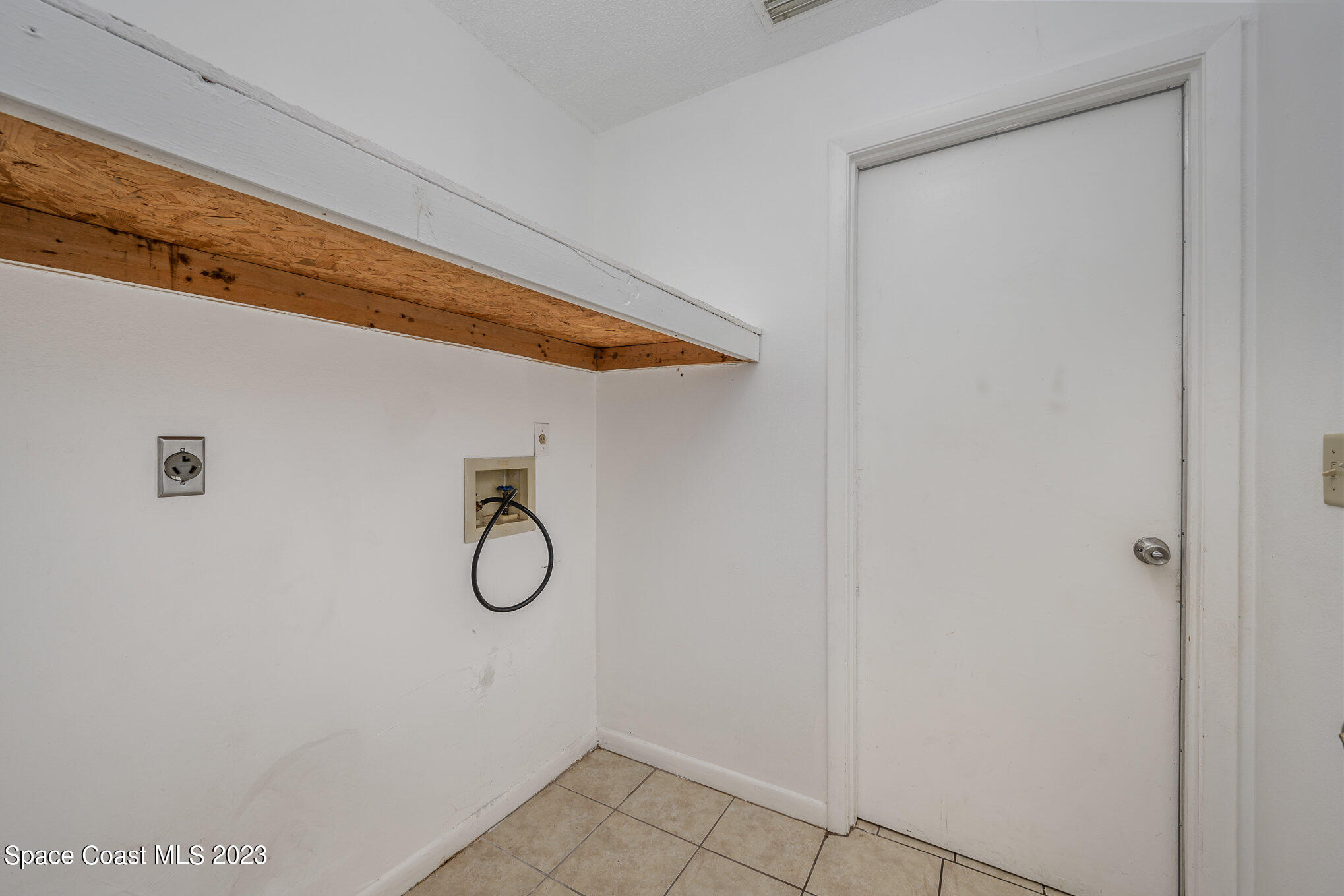1061 Spring Street Northwest Palm Bay, FL 32907 - Photo 20 of 23 a bathroom with a shower
