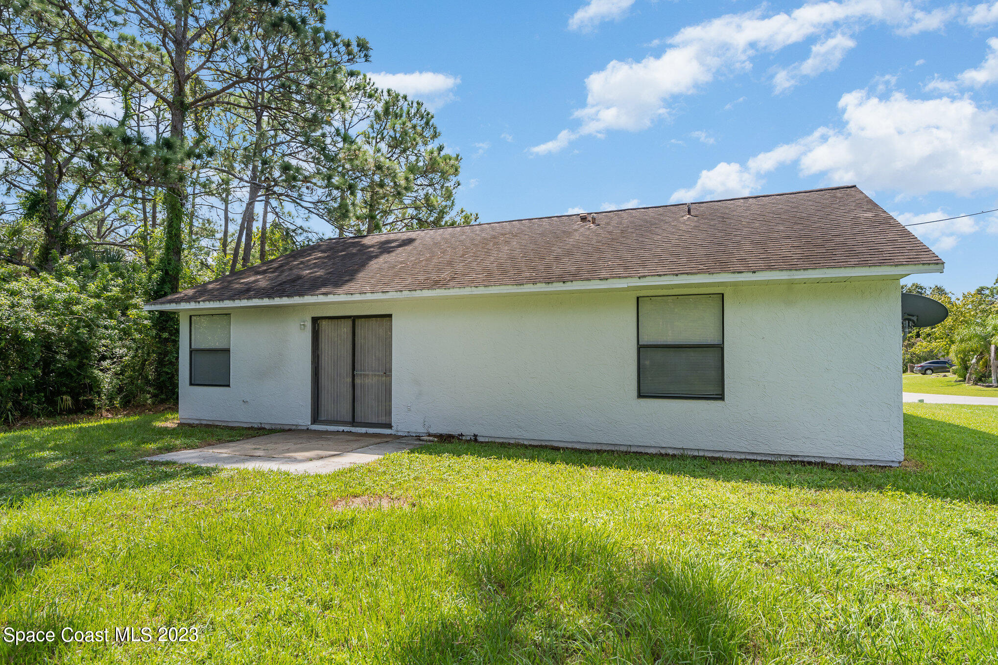 1061 Spring Street Northwest Palm Bay, FL 32907 - Photo 22 of 23 a view of a backyard