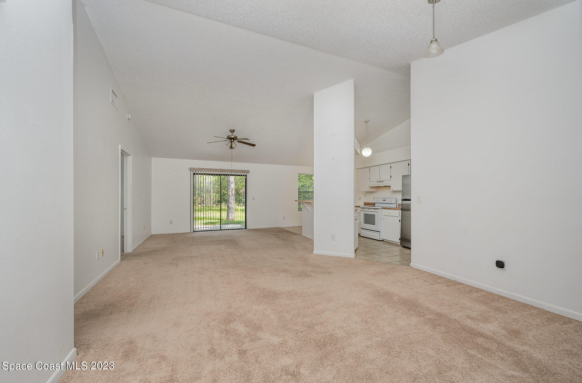 1061 Spring Street Northwest Palm Bay, FL 32907 - Photo 6 of 23 a view of empty room with windows