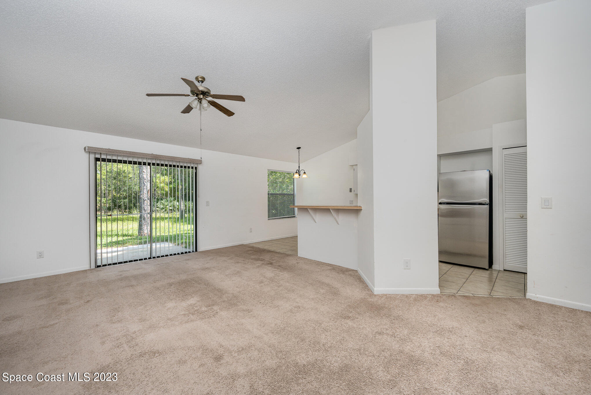 1061 Spring Street Northwest Palm Bay, FL 32907 - Photo 7 of 23 a view of an empty room with a window