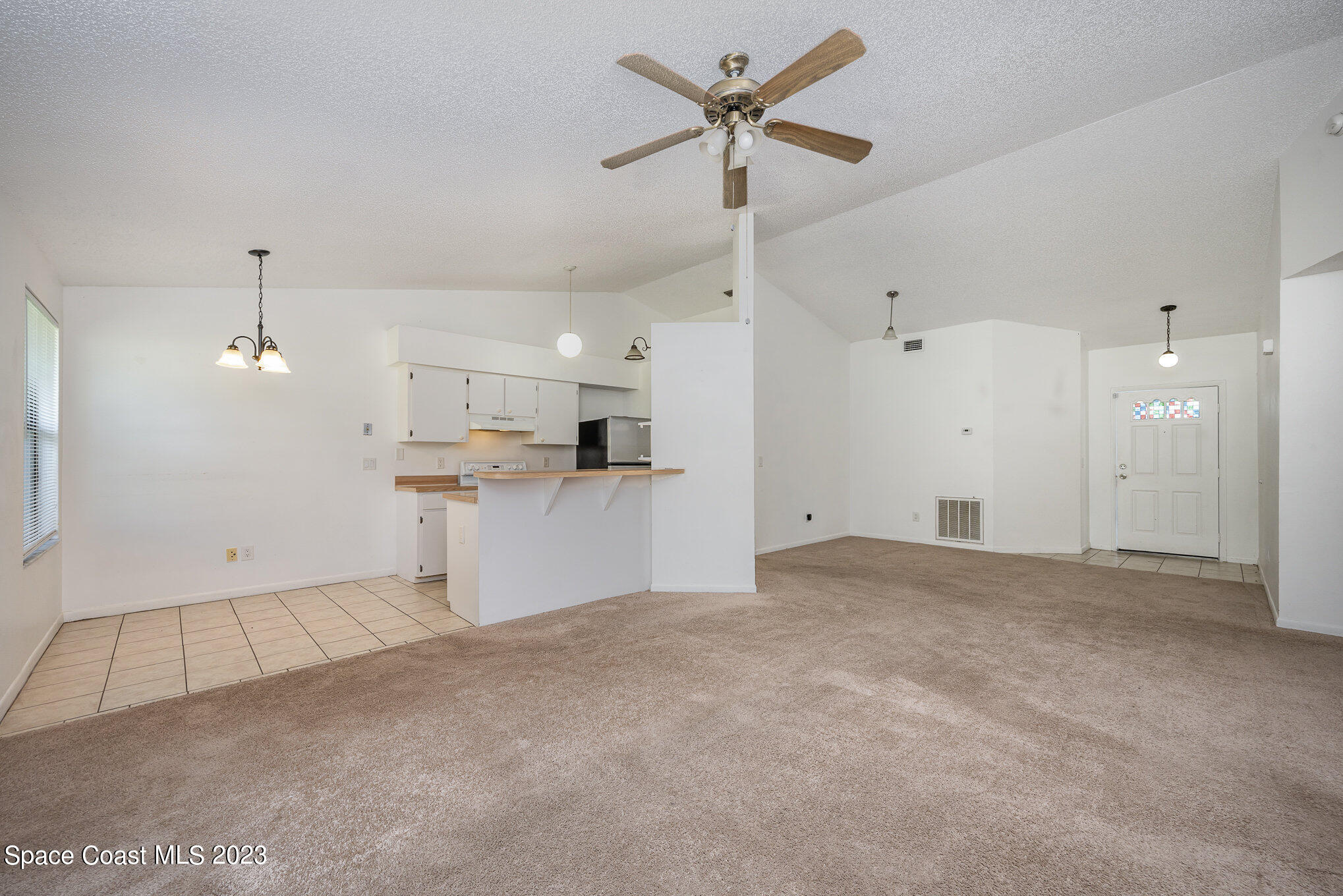 1061 Spring Street Northwest Palm Bay, FL 32907 - Photo 8 of 23 a view of a kitchen with a sink and stainless steel appliances
