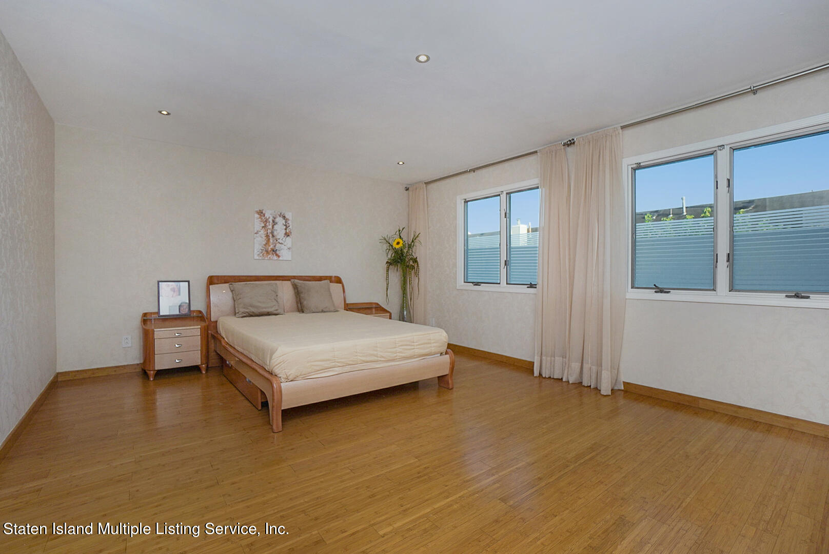 114 Commodore Drive Staten Island, NY 10309 - Photo 18 of 31 a bedroom with a bed and window