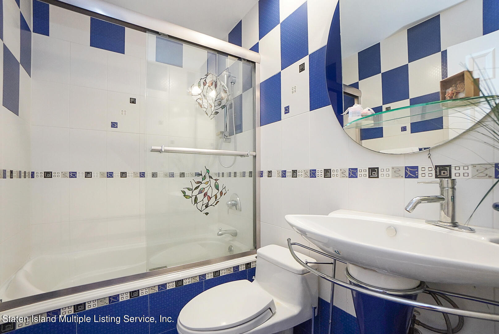 114 Commodore Drive Staten Island, NY 10309 - Photo 22 of 31 a bathroom with a sink toilet and shower