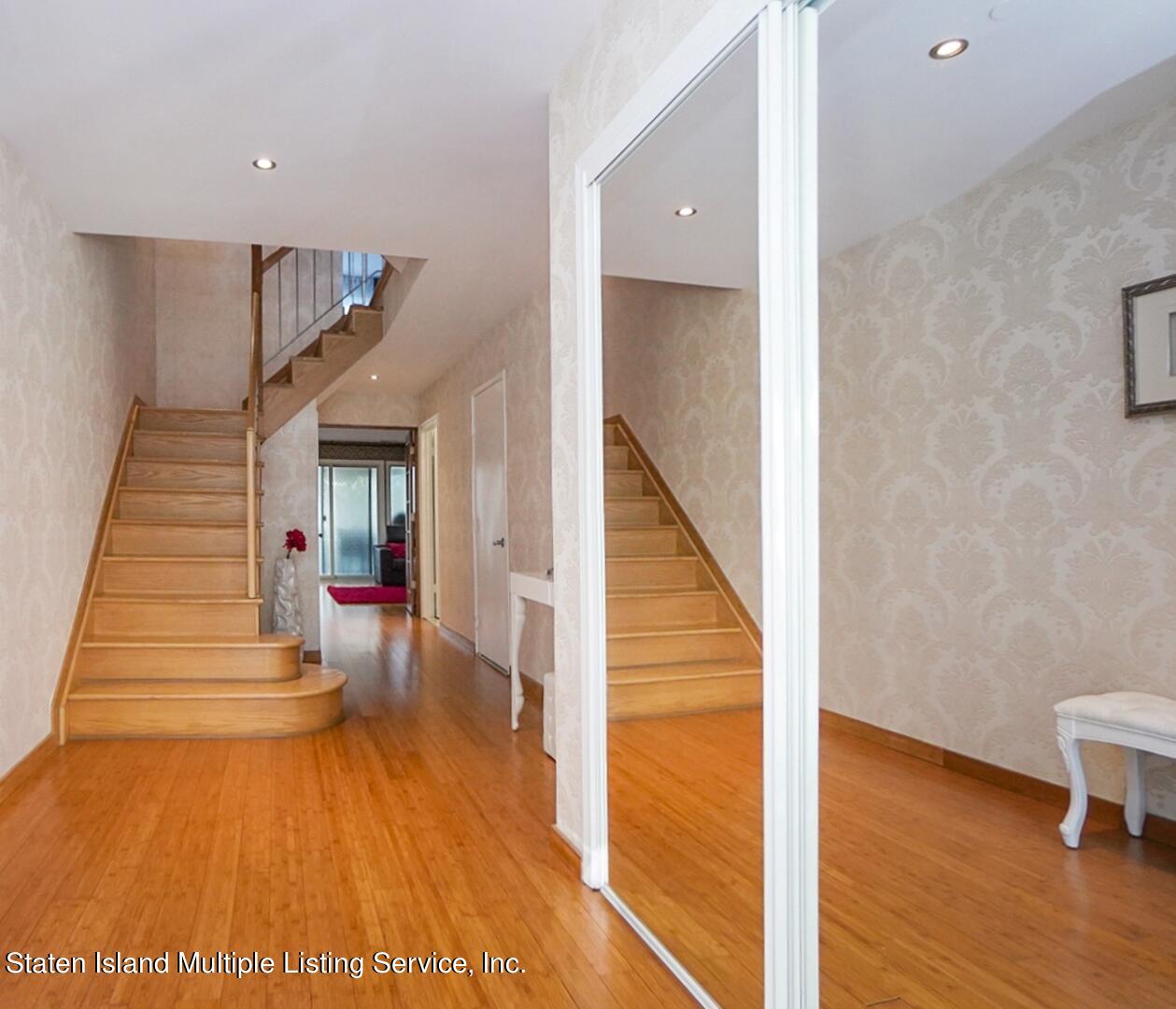 114 Commodore Drive Staten Island, NY 10309 - Photo 3 of 31 a view of entryway and hall with wooden floor