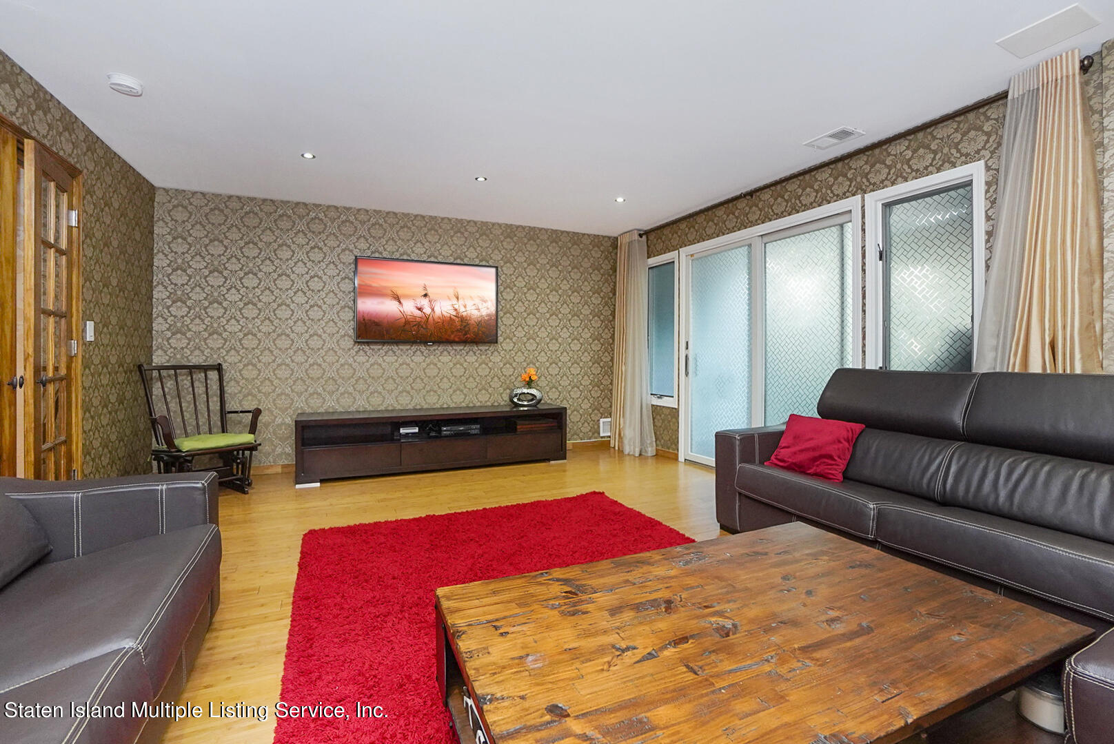 114 Commodore Drive Staten Island, NY 10309 - Photo 5 of 31 a living room with furniture rug and wooden floor