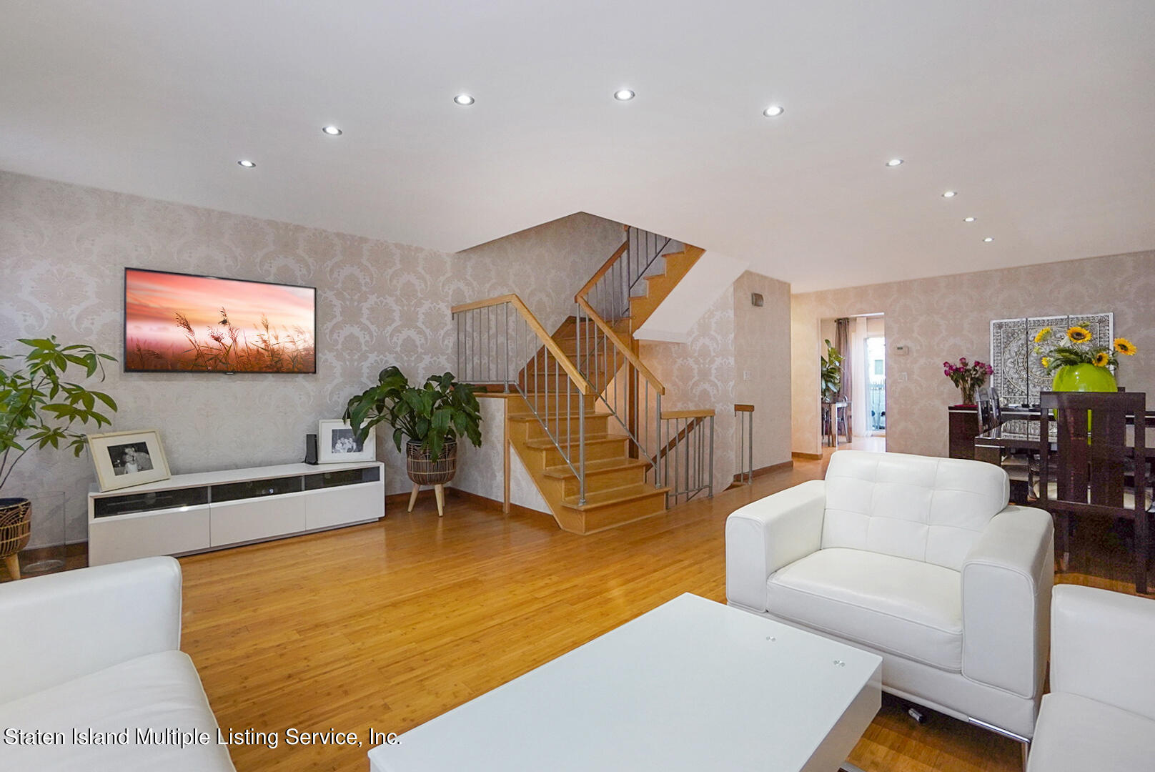 114 Commodore Drive Staten Island, NY 10309 - Photo 7 of 31 a living room with furniture and a flat screen tv