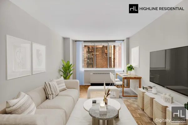 a living room with furniture and a window