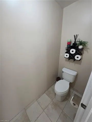 a bathroom with a toilet and a sink