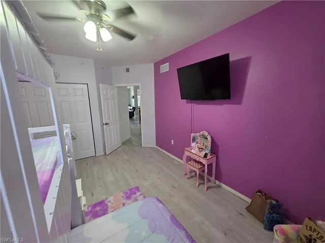 a living room with a flat screen tv and a couch