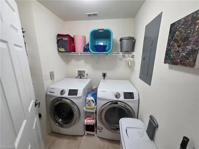 a utility room with dryer and washer