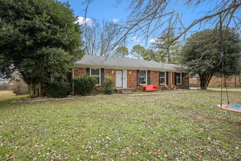 a front view of a house with yard