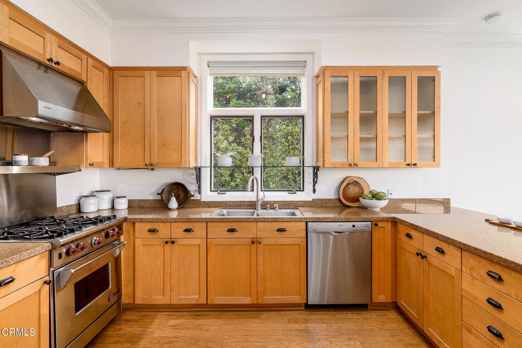 101 Rios Court Solana Beach, CA 92075 - Photo 21 of 67 a kitchen with stainless steel appliances granite countertop a sink stove and cabinets