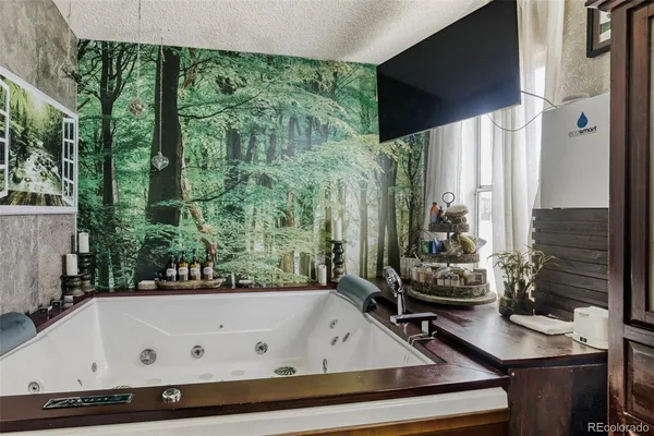 a bathroom with a bathtub and a window