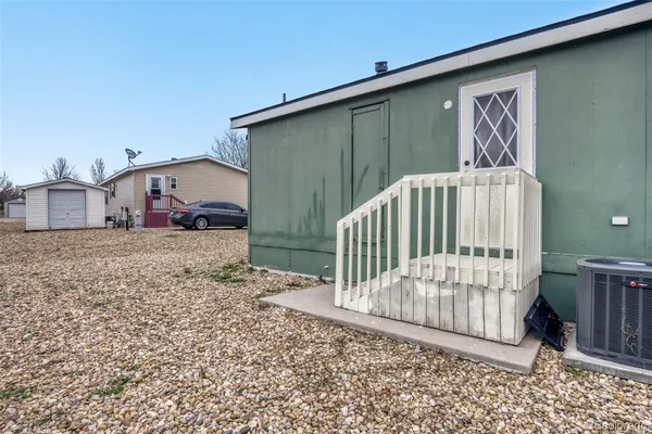 a view of a porch with a small yard