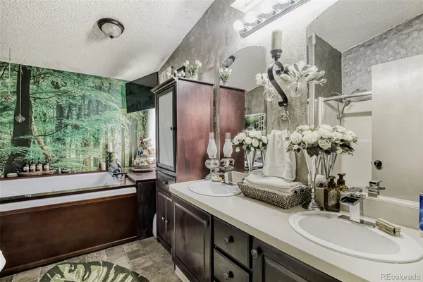 a bathroom with a sink double vanity and a mirror