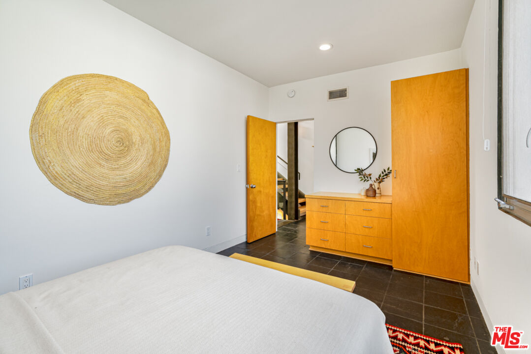 25 Brooks Avenue, Unit 3 Venice, CA 90291 - Photo 21 of 34 a bedroom with a bed and a dresser