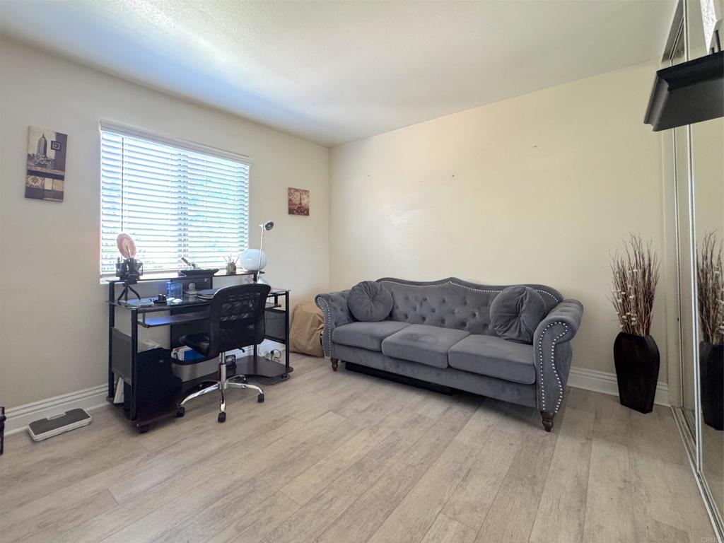 472 Graves Avenue, Unit 12 El Cajon, CA 92020 - Photo 9 of 10 a living room with furniture and a wooden floor