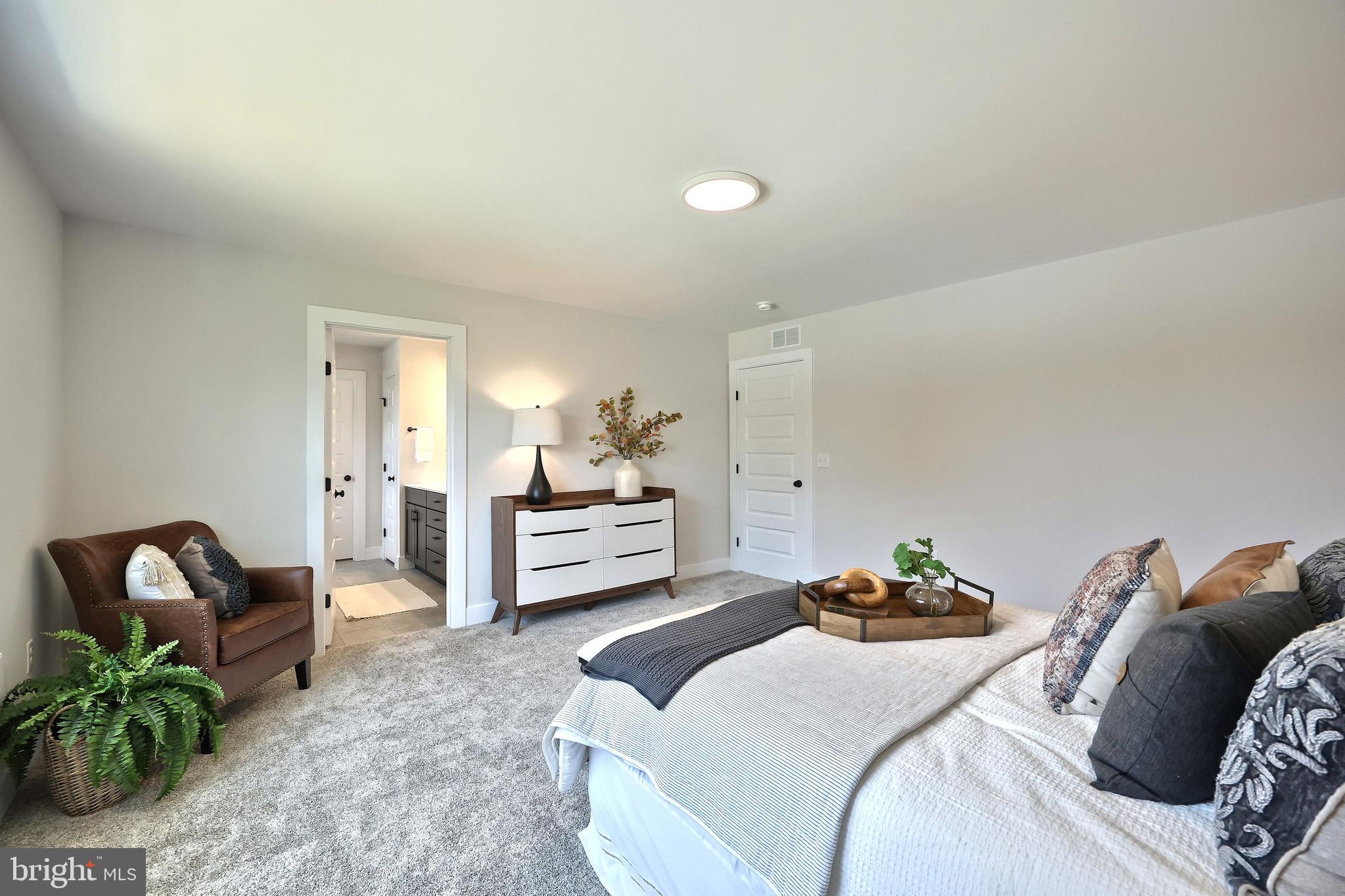 35 Vista Court Lititz, PA 17543 - Photo 23 of 32 a bedroom with a bed and a couch