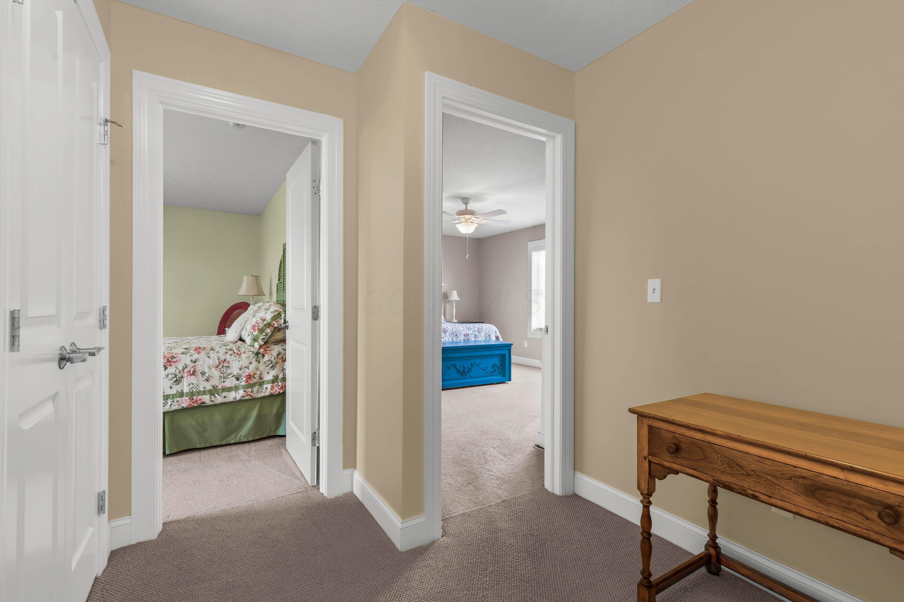 3582 Panhandle Road Delaware, OH 43015 - Photo 8 of 65 • Berber carpet • Vanilla painted walls • Ceiling light • Hall linen closet • Attic access