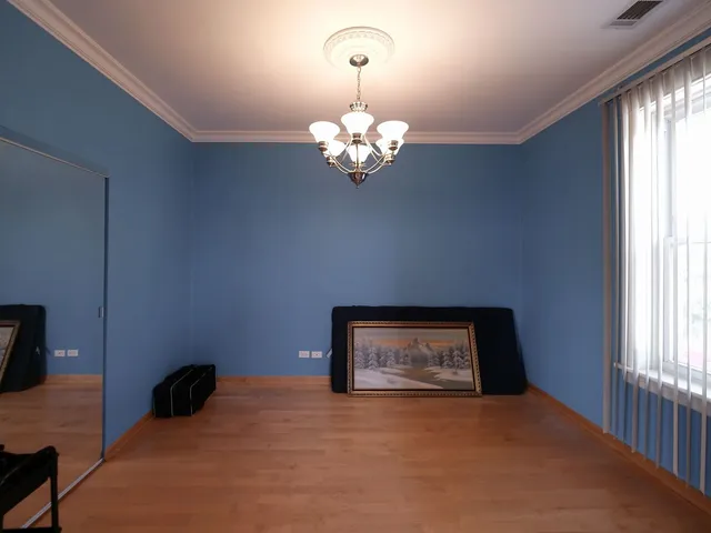 a bathroom with a tub and a potted plant