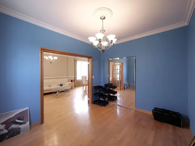 a bathroom with a double vanity sink mirror and toilet