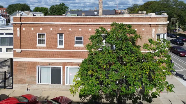 a view of a building with a yard