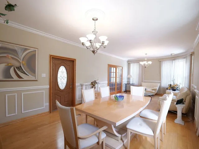 a kitchen with granite countertop a refrigerator oven a sink and dishwasher