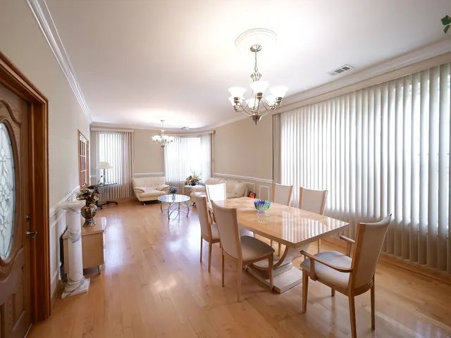 a living room with furniture fireplace and a large window