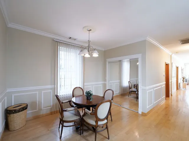 a kitchen with stainless steel appliances a stove a refrigerator cabinets and a window