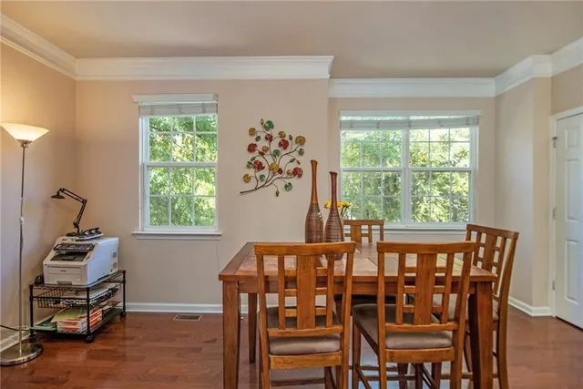 a view of a dining room with furniture window and outside view