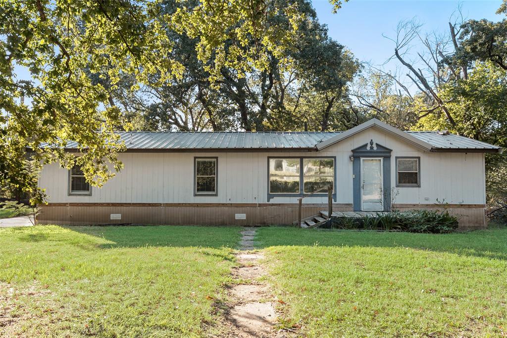 7634 Gibson Cemetery Road Mansfield, TX 76063 - Photo 1 of 1 View of front of property featuring crawl space, a metal roof, and a front yard