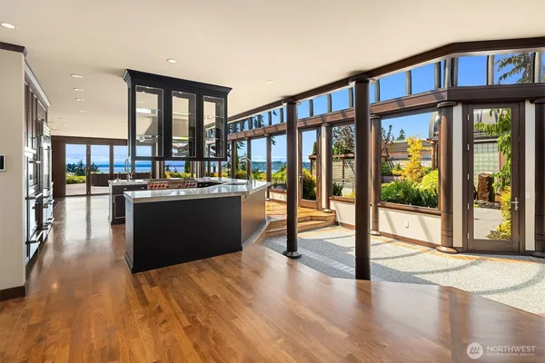 a view of a living room and kitchen with a large window