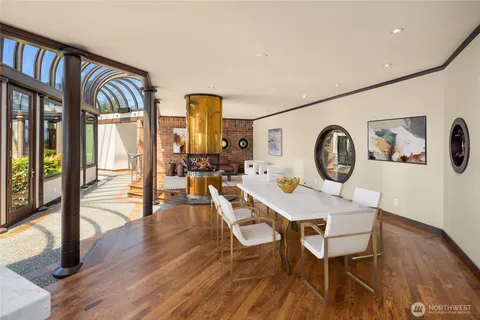 a view of a dining room with furniture window and wooden floor