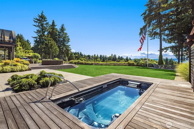 a view of a patio with chairs and a yard